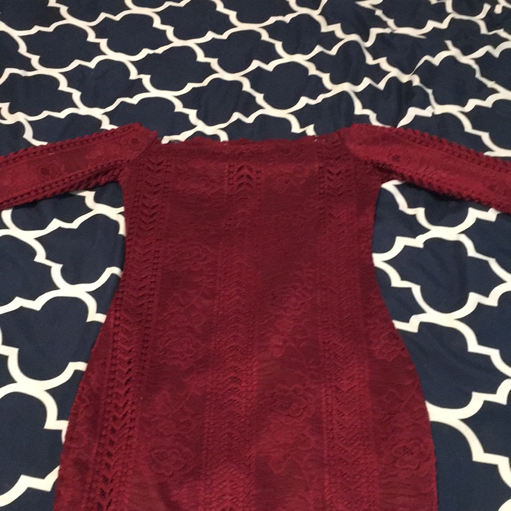 Red off the shoulder dress.